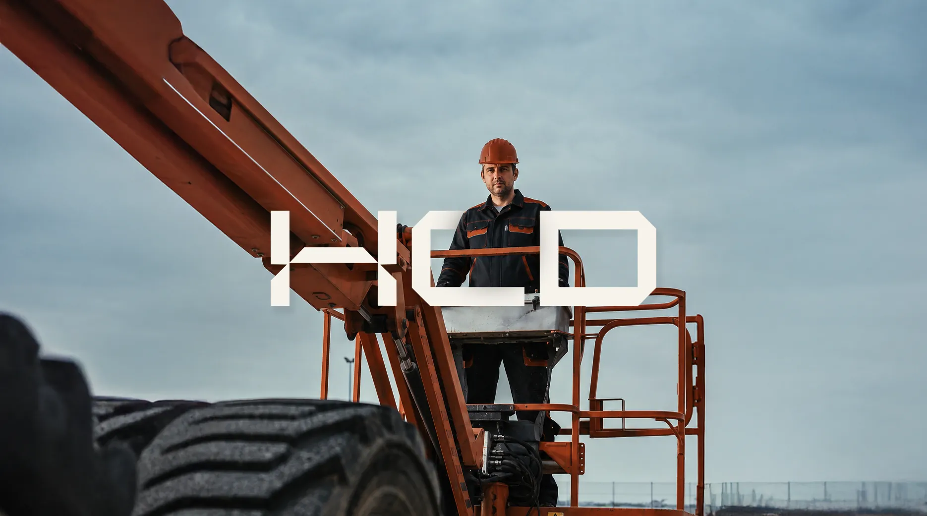 An HCD technician on a boom lift on site